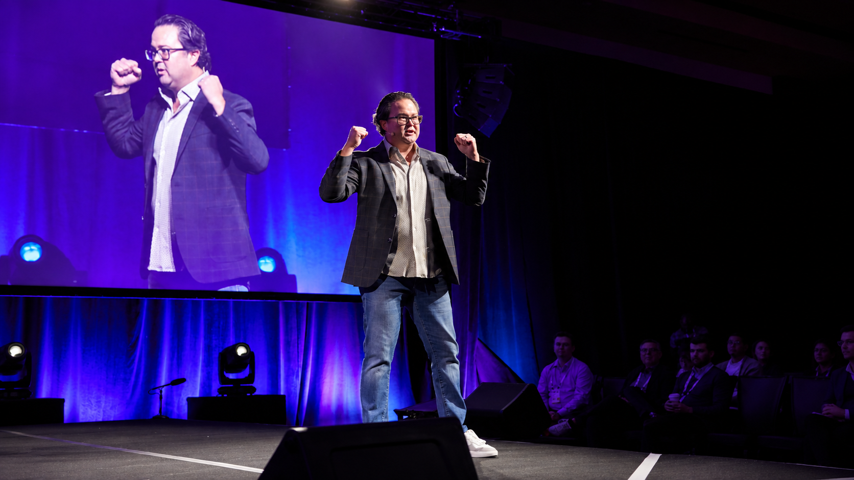 Mark Tack delivering a keynote on stage