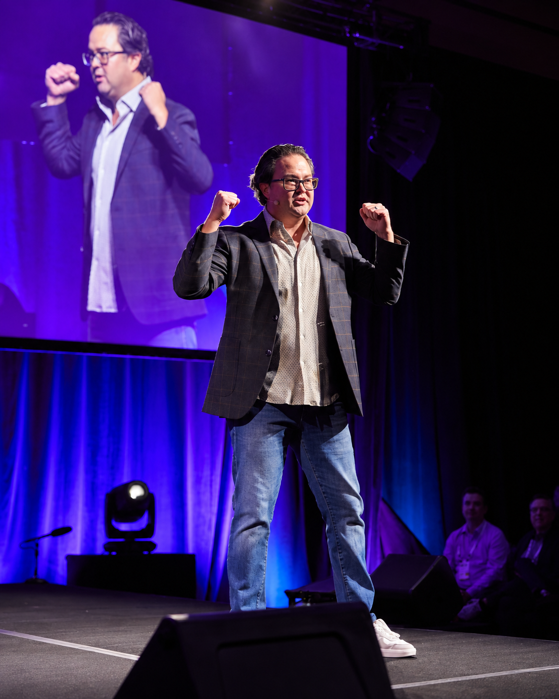 Mark Tack delivering a keynote on stage
